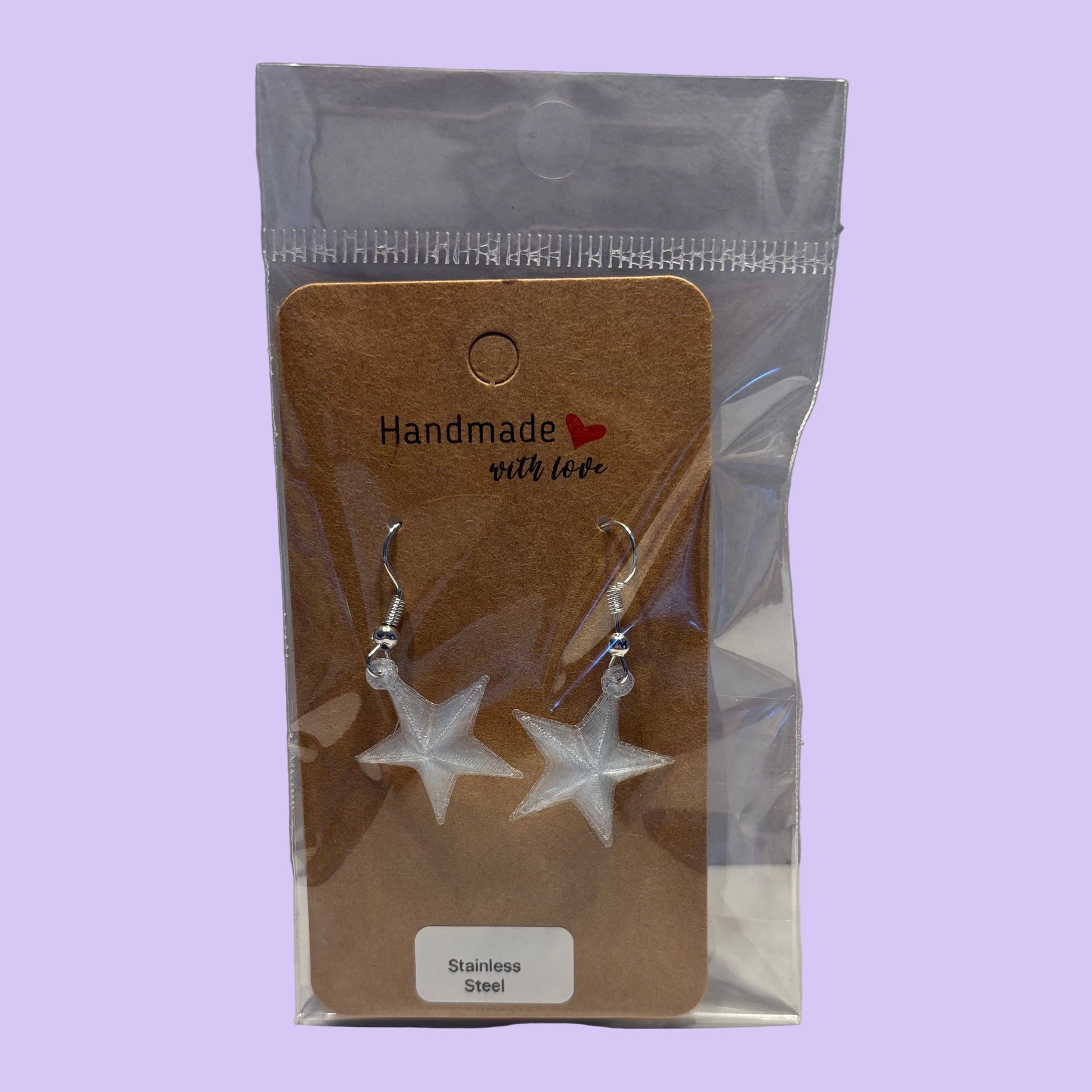 Christmas - Earrings - Star - Transparent Light Blue - Front View Packaged