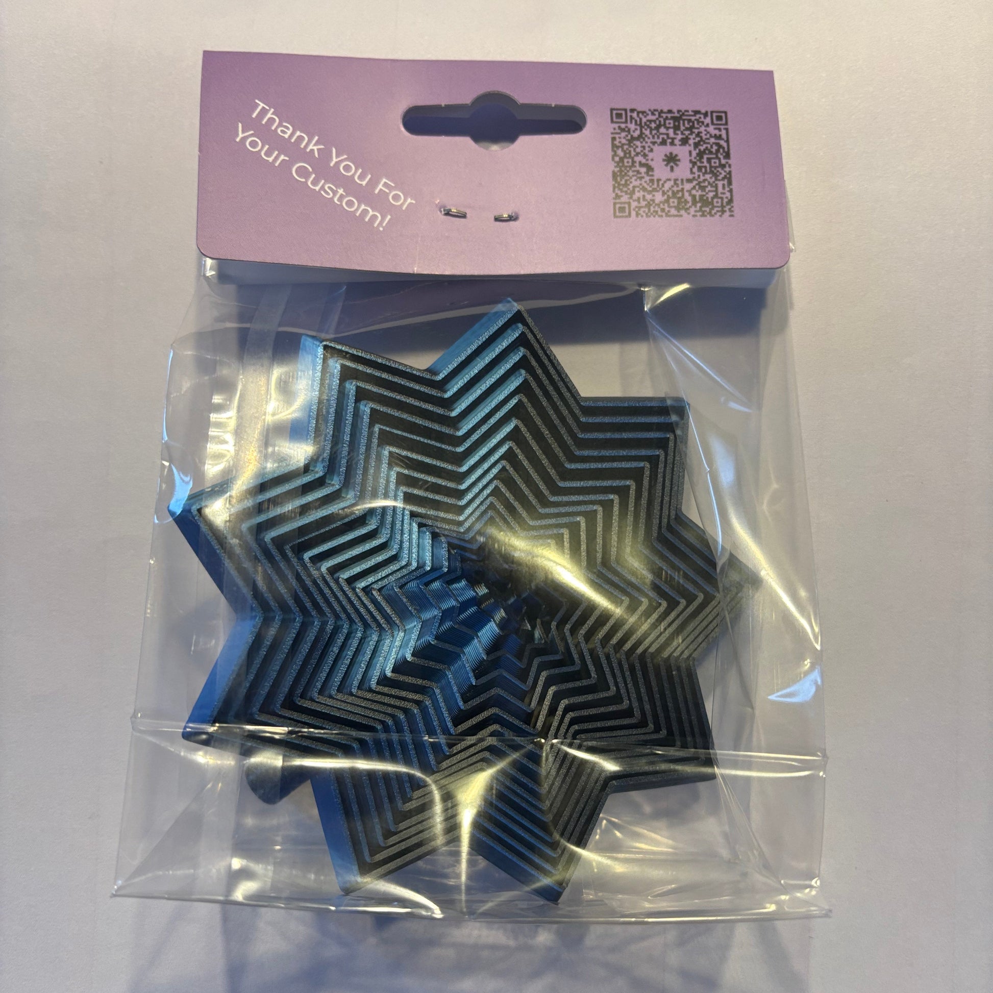 Living Aid - Sensory Star Super Fidget 100mm - Blue Black - Rear View Packaged